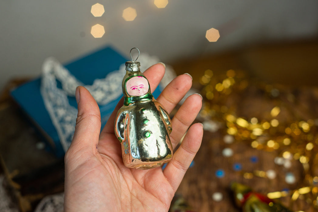 Girl Christmas glass ornament, winter child in a coat