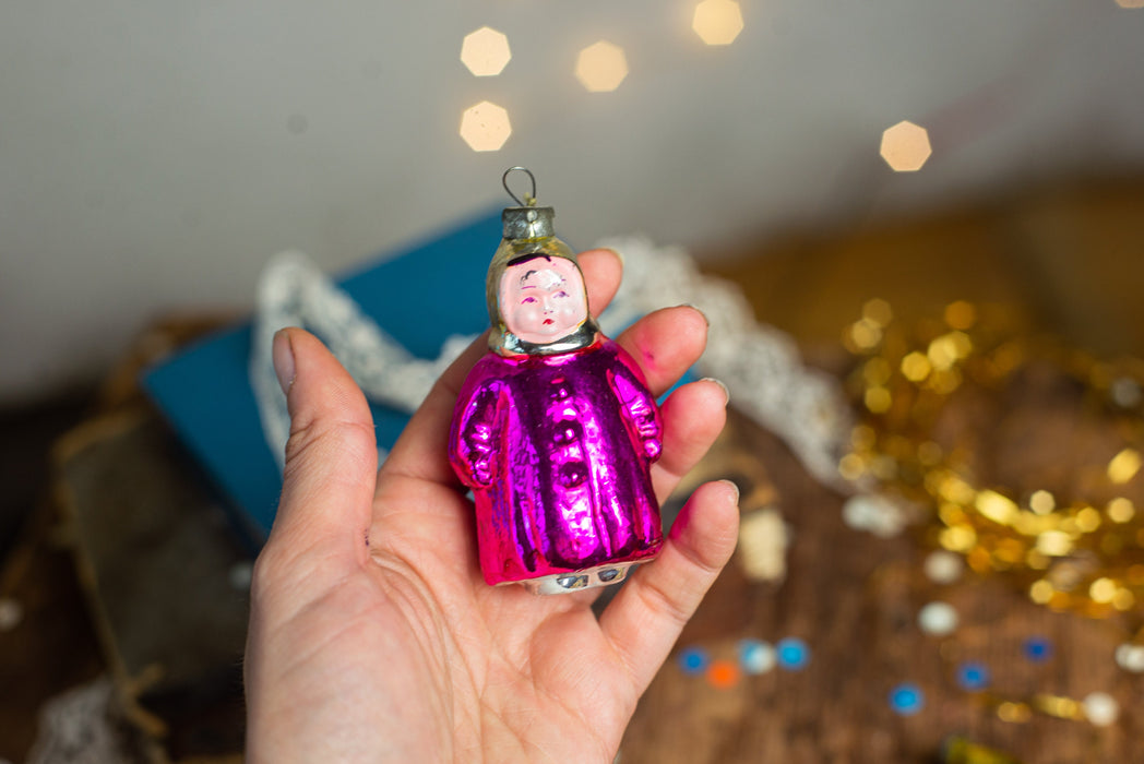 Girl Christmas glass ornament, winter child in a coat